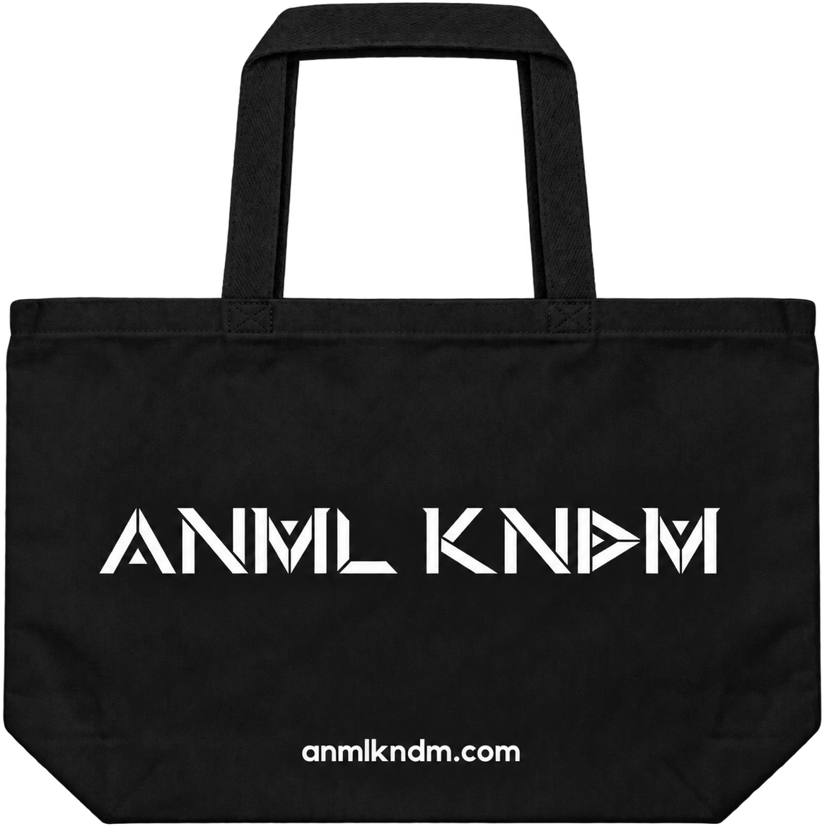All-black canvas tote bag with the ANML KNDM wordmark in white